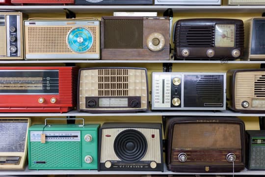 Shelves of vintage tabletop radios in every color
